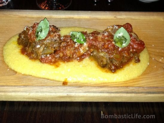 Polenta – beef short ribs braised with tomato with lamb neck and pork sausage, served over soft spelt and corn polenta, finished with grana cheese at Buca