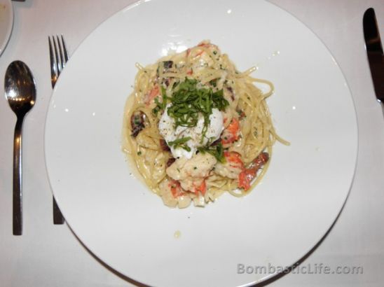 Linguine Carbonara served with lobster, bacon, and poached egg at One Restaurant at the Hazelton Hotel in Toronto