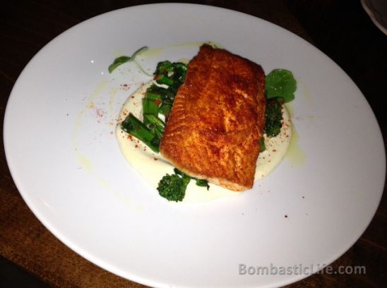Norwegian Ocean Trout with sautéed rapini, smoked cauliflower puree and espelette pepper at Campagnolo Italian Restaurant in Toronto