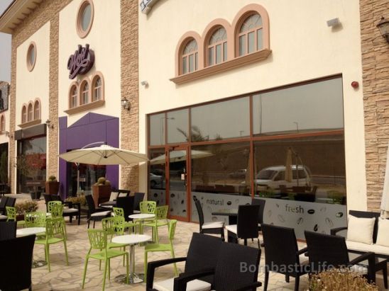 Outdoor seating area  at Cilantro Cafe at the Village in Kuwait