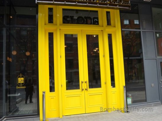 The Big Yellow Door of Weslodge on King Street West in Toronto