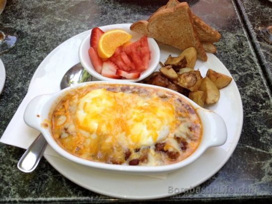 Texas Eggs, a casserole of beef chili, two soft poached eggs, Swiss and cheddar cheese Pear Tree Restaurant in Toronto