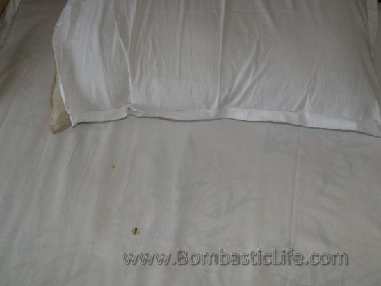 Here is a picture of the bed in our bedroom on Soma Houseboats.  The bed was disgustingly dirty and the sheets had holes and stains in them.