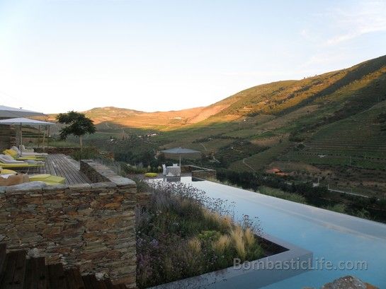 The outdoor pool at  Quinta da Romaneira - Douro Valley, Portugal sits on the cliff overlooking the river below.