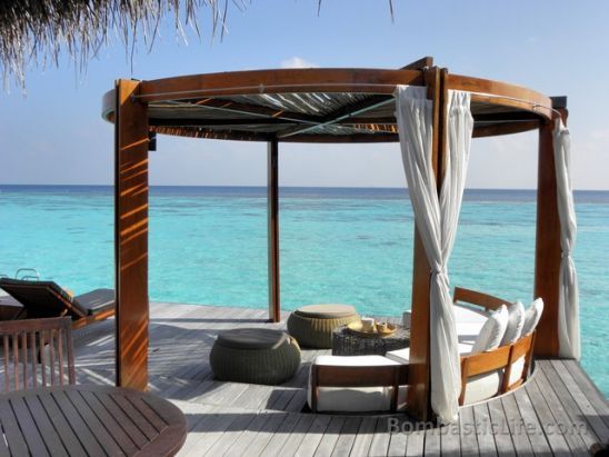 Private deck of an over the water villa at the W Hotel in the Maldives.