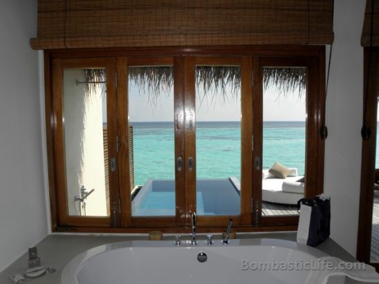 Deep soaking tub in the bathroom of an over the water villa at the W Hotel in the Maldives.