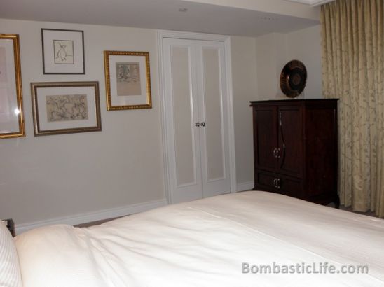 Bedroom of our Executive Suite at The Peninsula Hotel in New York, NY.  The doors lead to the bathroom.