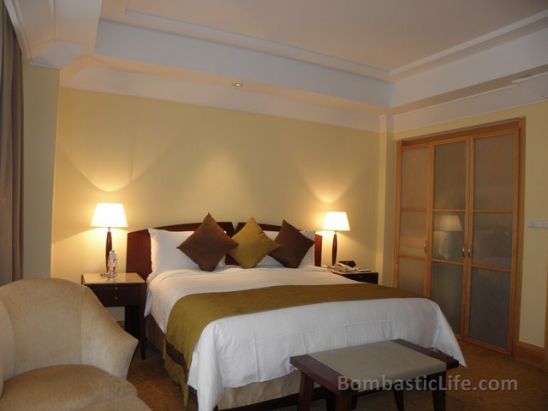 Bedroom of a Fullerton Suite at Fullerton Hotel in Singapore.