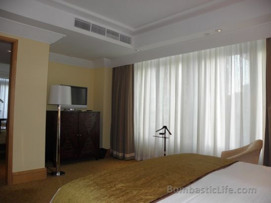 Bedroom of a Fullerton Suite at Fullerton Hotel in Singapore.