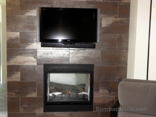 Picture of the wall that separates the living room from the bedroom. Note the see through fireplace.