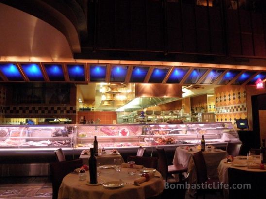 Picture of the open kitchen and seafood/meat case at Le Latini Italian Restaurant in Montreal, Quebec.