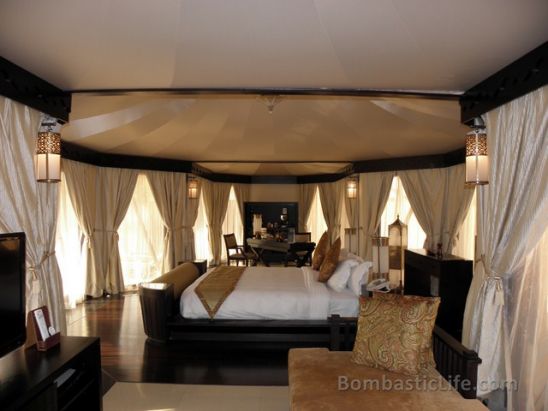 Living Room and Bedroom of an Al Sahari Tented Pool King Villa at Banyan Tree Al Wadi in Ras Al Khaimah.