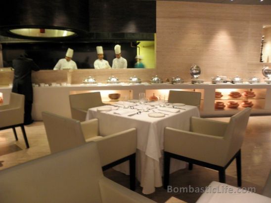 Dining room and open kitchen at Rang Mahal Indian Restaurant in Singapore.
