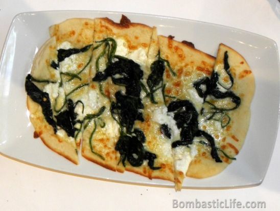Pizza with goats cheese, garlic and spinach at Sala Bistro in Manila.