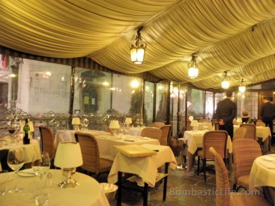 The covered outdoor dining room of Antico Martini Restaurant in Venice, Italy.