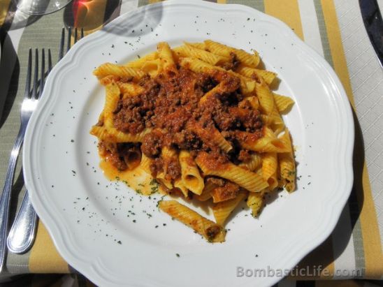 Garganelli, hand-made tube pasta with meat sauce at La Bottega in Tuscany.