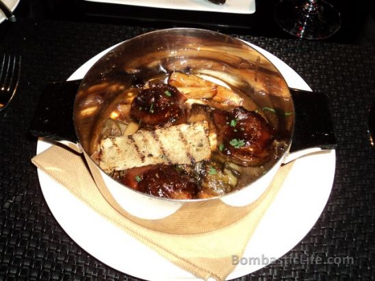 Braised Veal Cheeks with King Trumpet Mushrooms, Creamy White Polenta and Black Garlic at Sage Restaurant at Aria in Las Vegas. 