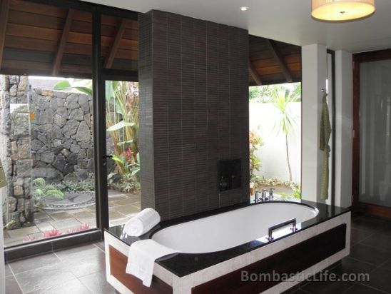 Bathroom of a Beach Villa at the Four Seasons Mauritius.  You can see the garden shower through the window.