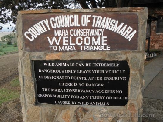 Entrance to the Masai Mara Conservancy.  Read the sign closely.  