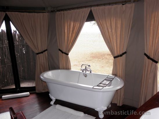 Deep soaking tub in a luxury tent at Singita Sabora Tented Camp - Grumeti Reserves, Tanzania.