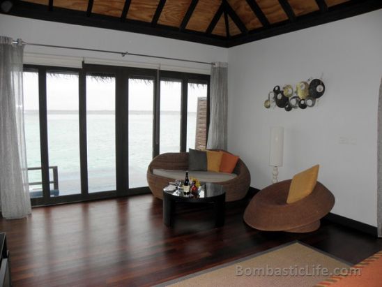 Living room of our Water Villa with Pool at Velassaru Resort Maldives.