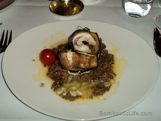 Roasted Monkfish wrapped in aubergine with lentils, pumpkin, olives and orange sauce at Massimo in London
