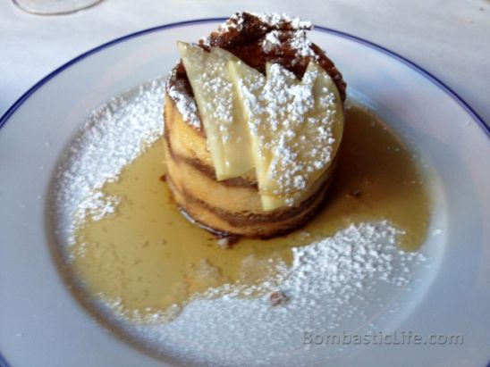 Bouchon French Toast - Bread pudding style with warm layers of brioche, custard & apples. Served with maple syrup